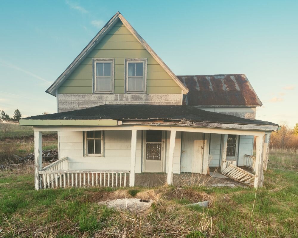 Visible signs of structural damage in a condemned house, emphasizing the need for urgent repairs