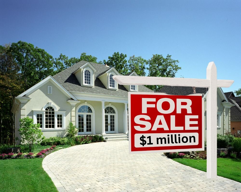 A "For Sale" sign in front of a home with an unrealistic high price turning potential buyers away.