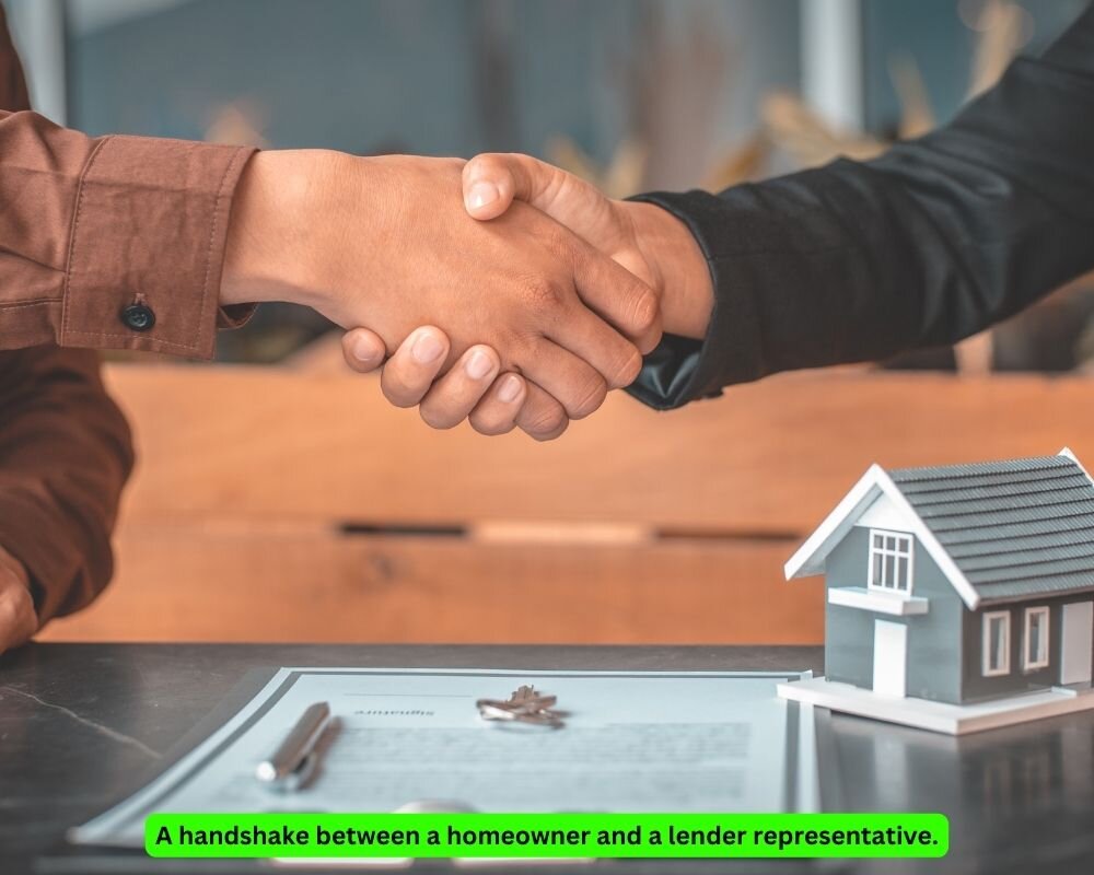 Homeowner and lender representative shaking hands on loan modification