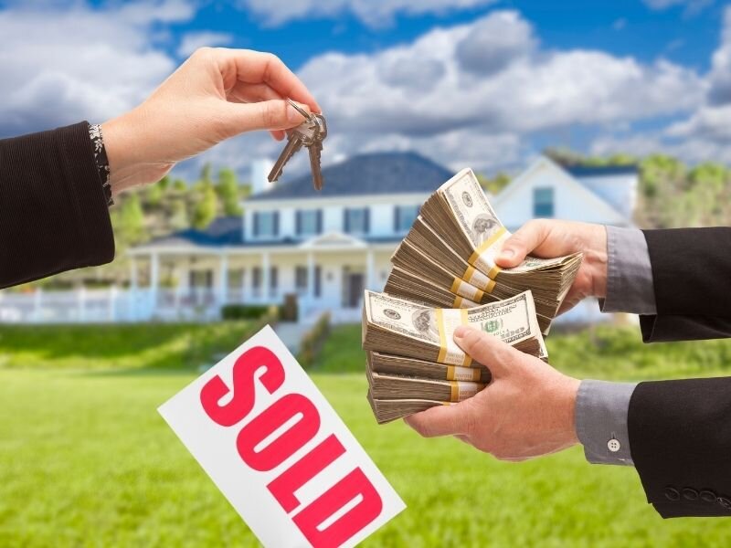 a sold house for cash handling keys and cash