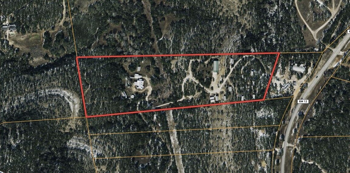 Aerial map of the Hays County property at 10703 Ranch Road 12 with the property boundary outlined in red
