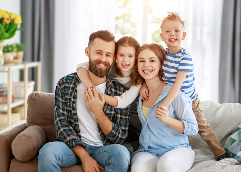 happy family sitting on couch