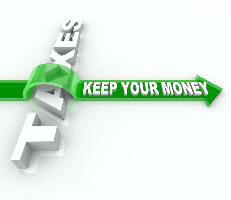 arrow jumping over the word taxes
