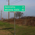 Mileage Sign- Henrietta 21 - Wichita Falls 42, Belcherville, TX-USA