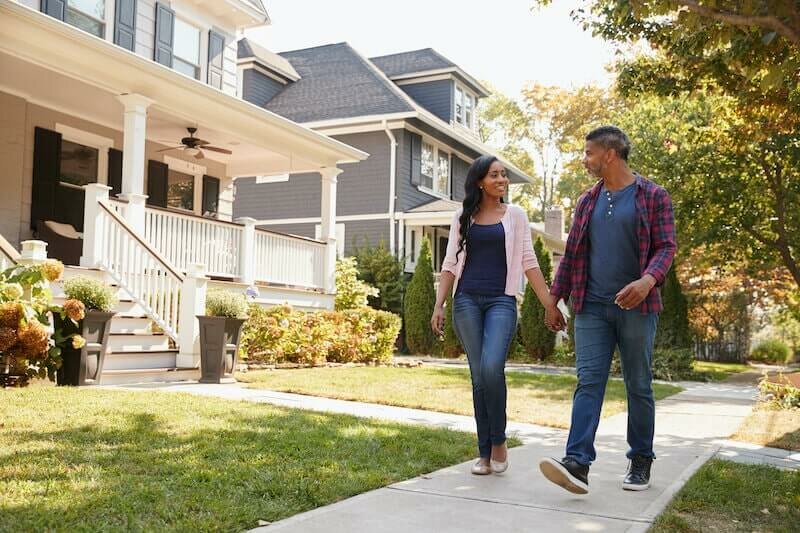 couple having a romantic walk in a famous neighborhood in Dallas