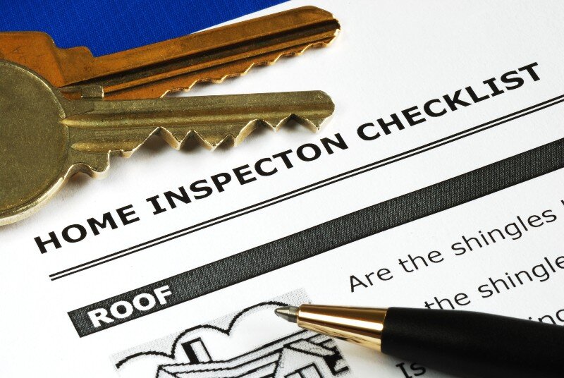 An appraiser goes through a home inspection checklist in a house in Texas.