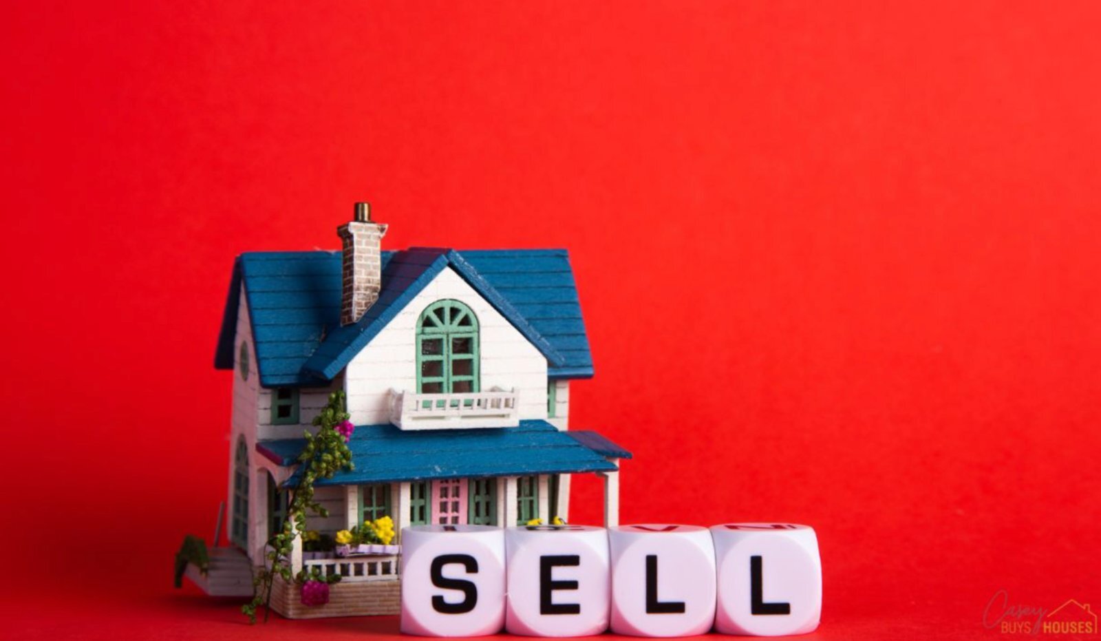 Model house next to dice spelling SELL, things to do before selling your house in Chino, CA