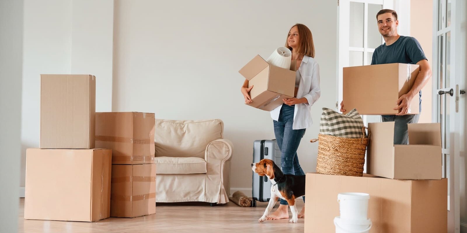 man and woman moving into new home