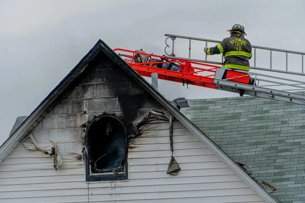 fireman putting out house fire