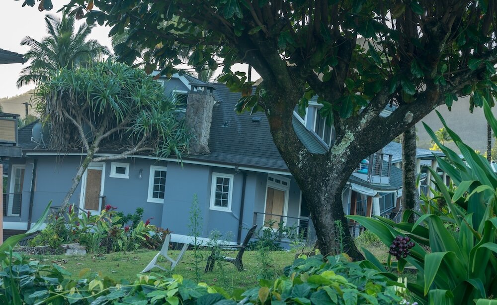 House tipping into sinkhole