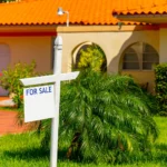 Image of For Sale sign in front of a house in Florida