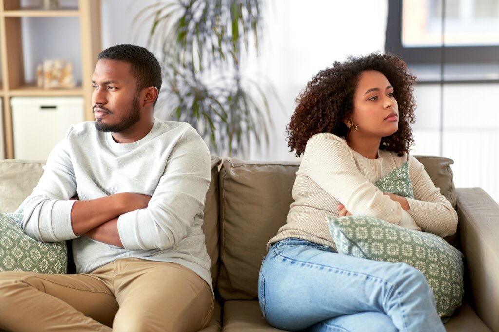 Divorcing homeowners reviewing documents for a house sale in Plantation, Florida
