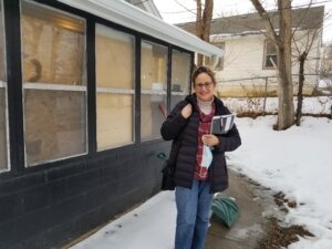 Anna Buys Houses assessing a home for a direct sale.