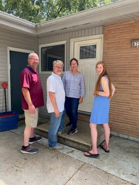 Anna Buys Houses viewing an Omaha property.