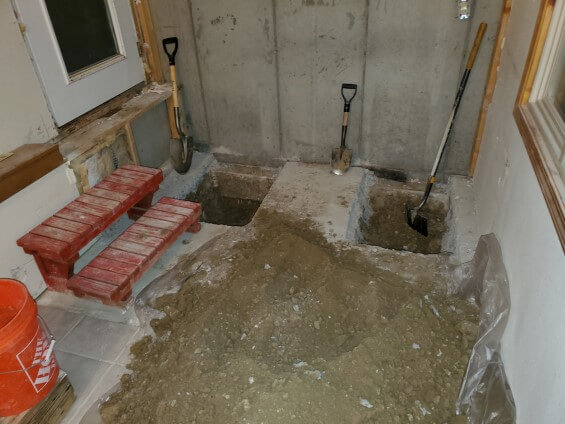 Foundation repair underway in the sun room of a Wyoming remodel project.