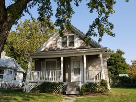 Street view of a house before rehab.