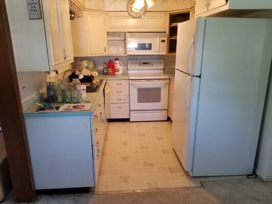 Kitchen before rehab showing how it is closed off from the rest of the house.