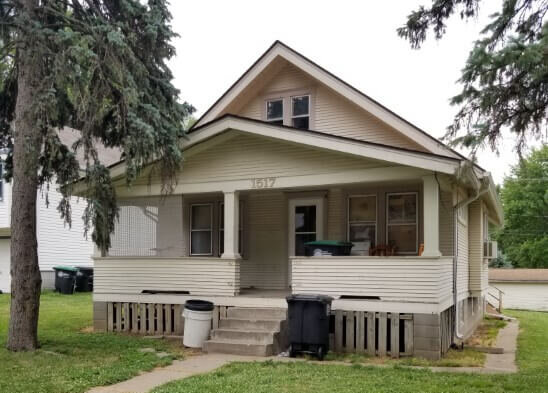 Exterior view of an Omaha house before being remodeled by Anna Buys Houses.