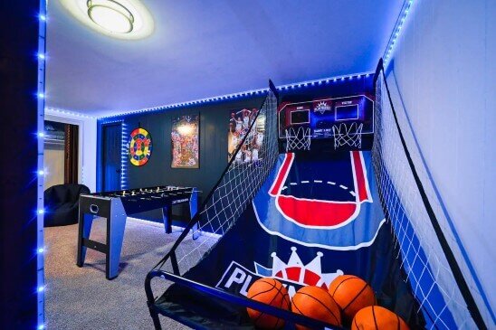 Rec room complete with arcade games after Anna Buys Houses rehab.