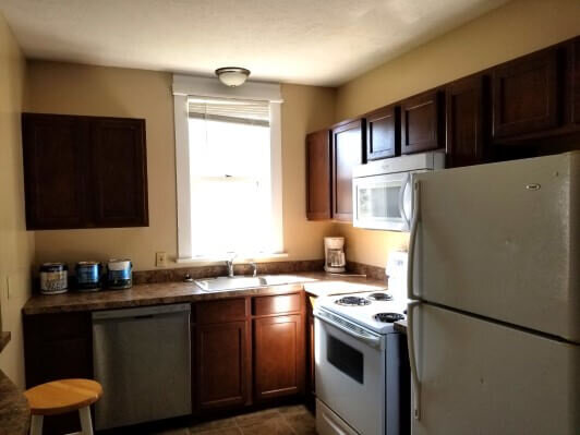 York, NE apartment kitchen before Anna Buys Houses rehab.