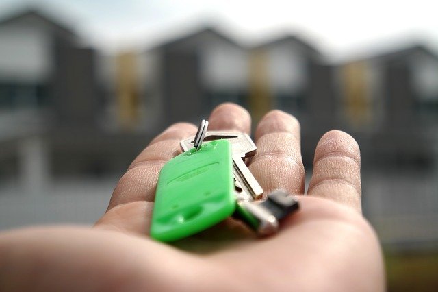 Man holding keys for owner financing in Houston