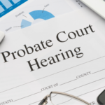 This image depicts a scene of preparation for a probate court hearing. Key items include a legal document titled "Probate Court Hearing," a calculator, a pair of eyeglasses, and financial charts on a tablet. These elements signify the combination of legal and financial considerations involved in probate proceedings.