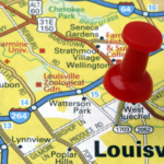 A close-up of a map highlighting Louisville with a red pushpin, symbolizing the focus on discovering the city's most expensive properties. The map details various neighborhoods and landmarks, emphasizing the prime locations of Louisville's luxury real estate.