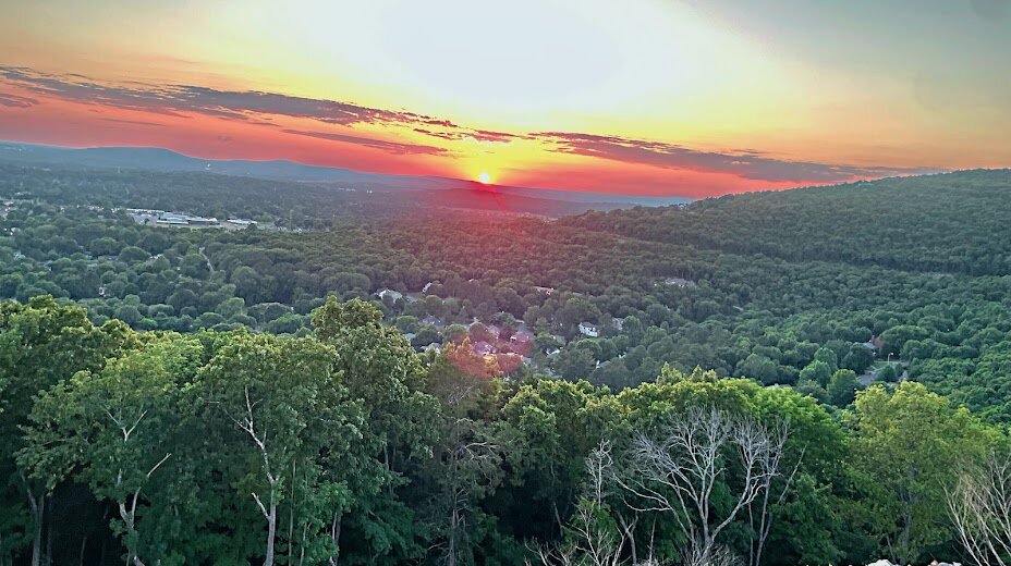 birds eye view of Blevins gap nature preserve with a beautiful sunset in the background. We Buy Houses in Owens Cross Roads Alabama