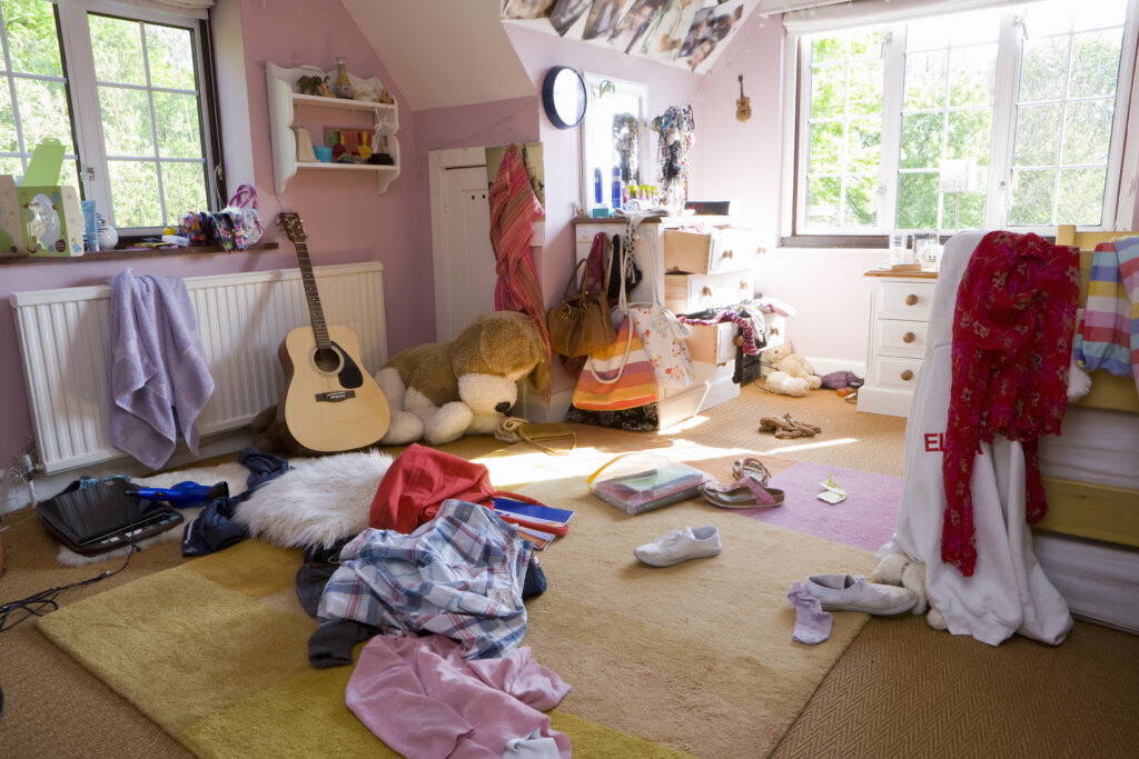 Cluttered house interior in Southwest Michigan with boxes and household belongings before selling