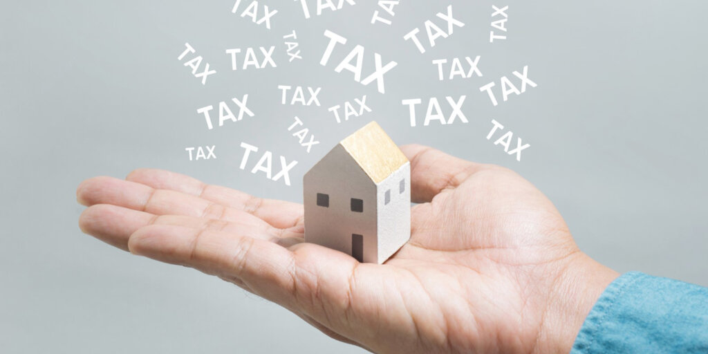 Southwest Michigan real estate investor reviewing rental property expenses and tax records