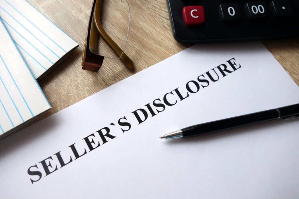 Southwest Michigan homeowner reviewing house disclosure documents before selling a property