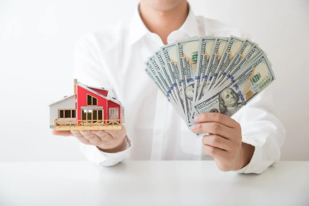 Homeowner comparing a local Southwest Michigan cash home buyer with a national home-buying company