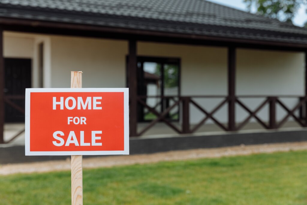 Out-of-state heir reviewing documents while selling an inherited house in Southwest Michigan