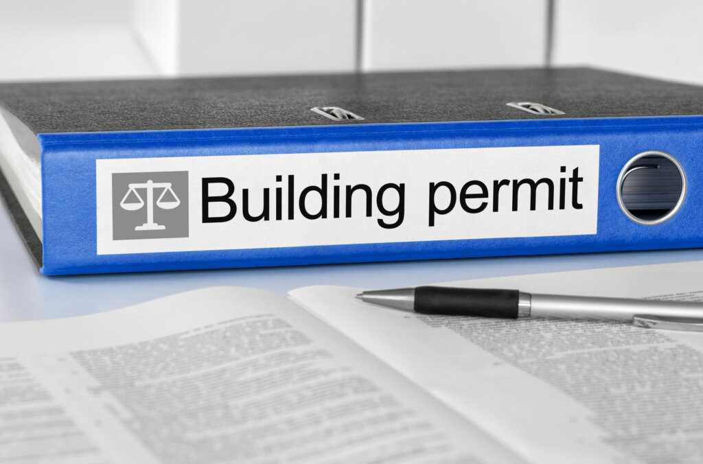 Fort Wayne homeowner reviewing an open building permit and inspection records before selling a house
