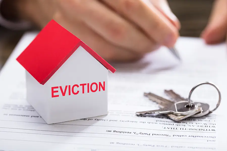 Fort Wayne landlord reviewing rental-property sale and eviction documents