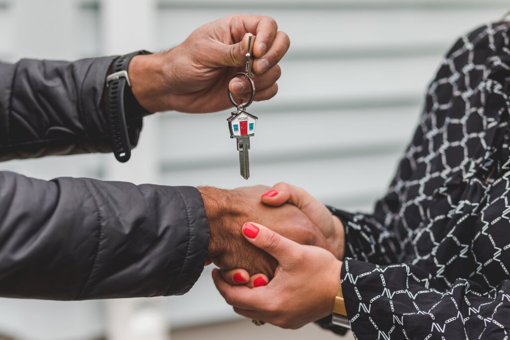 Townsend Realty Group agent handing keys to new client in Atlanta
