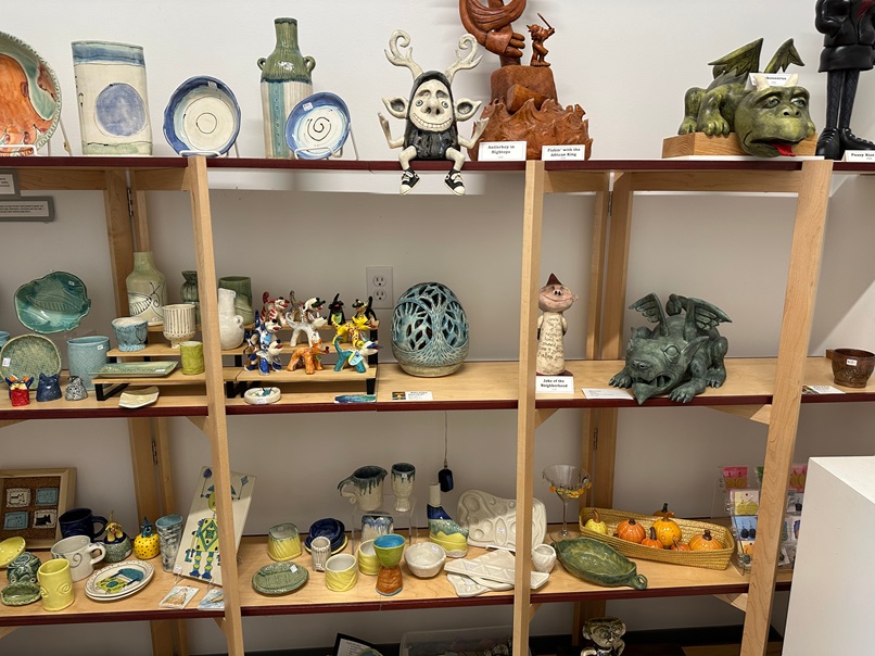 Exploring a vibrant display of handcrafted ceramics and whimsical sculptures by local artists at the Edmonds Art Walk.