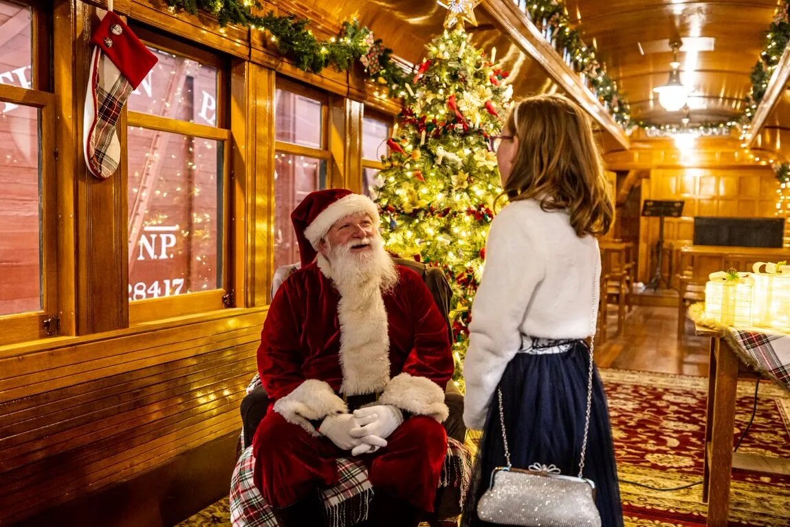 Santa greeting families aboard the Northwest Railway Museum Santa Train in Snoqualmie Washington