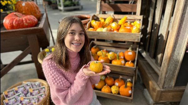 Juliaโs all smiles with her pumpkin at Shoreline Placeโs festive Thanksgiving display! ๐๐ Moments like these showcase the charm of our communityโcould it influence your next real estate prediction?