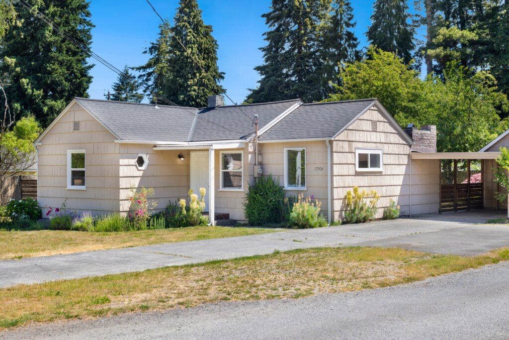 Shoreline home with detached studio and garden