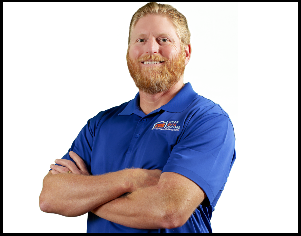 Photograph of Greg wearing a royal blue shirt