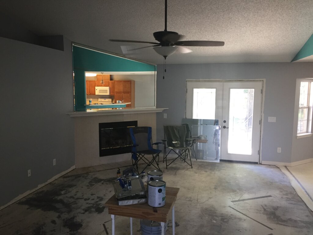 Photograph of living room requiring excessive repairs