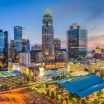 Charlotte, NC skyline at dusk, where Helpful Homes buys houses for cash