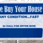 Blue and white sign reading “We Buy Your House Any Condition... Fast Call for Offer Now,” attached to a chain-link fence
