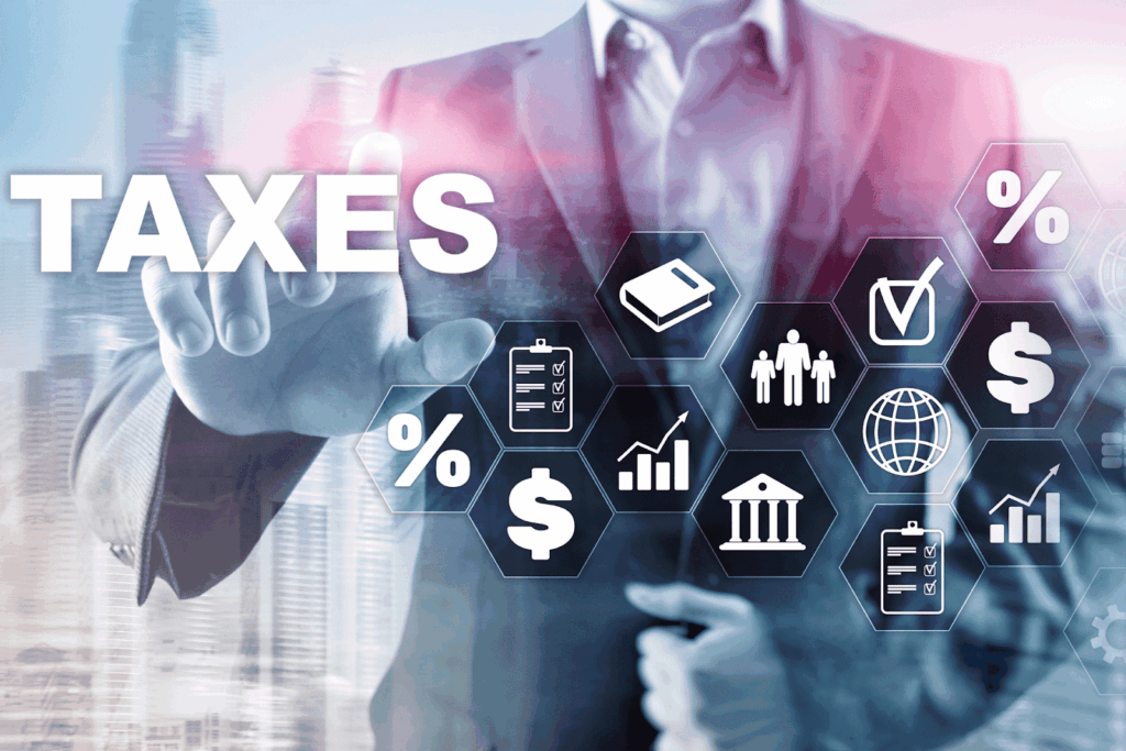 Businessperson touching virtual icons related to taxes and finance