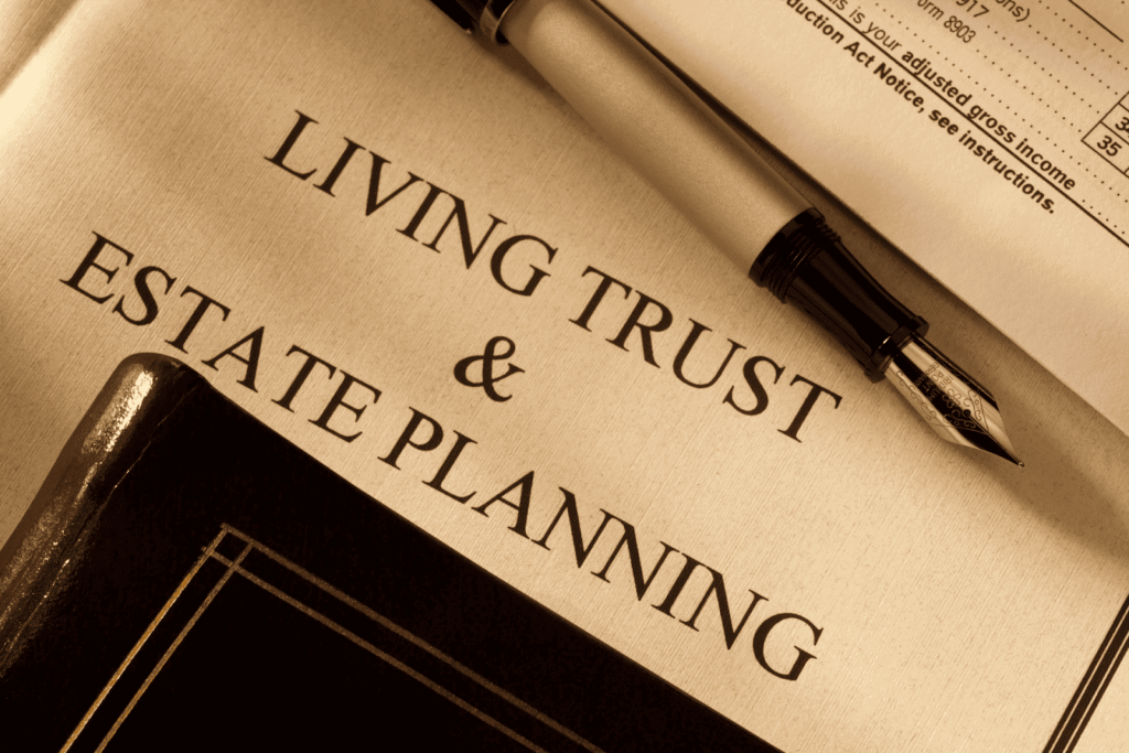 Close-up of a document titled ‘Living Trust & Estate Planning’ with a fountain pen and folder.
