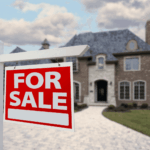 For Sale sign in front of a large brick house.