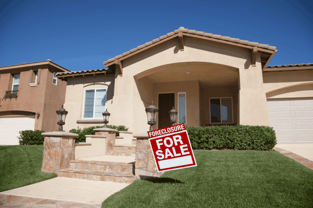 Foreclosure for sale sign in front of a suburban house