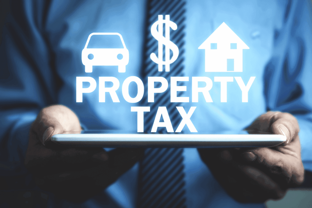 Person holding tablet with digital icons and the words Property Tax