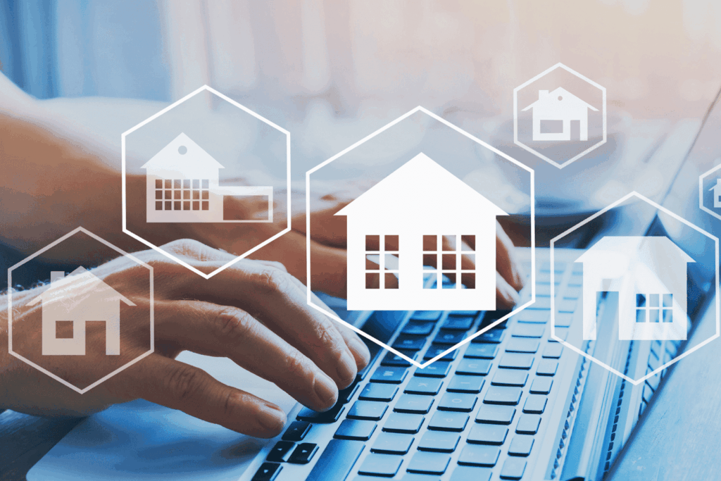 Person using laptop with digital house icons representing real estate search